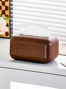 Close-up of dark walnut wood grain texture on a minimalist plastic tissue box organizer