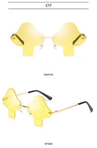 Macro shot of stylish yellow mushroom-shaped rimless sunglasses with gold metal temples