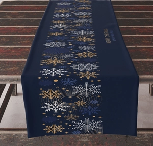 Detail of Christmas table runner with gold snowflakes and Merry Christmas lettering