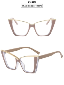 Close-up of khaki cat-eye glasses with gold metal accents and V-shaped silhouette