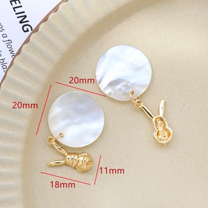 Detail of mother of pearl rabbit drop earrings in gold plated finish for DIY jewelry