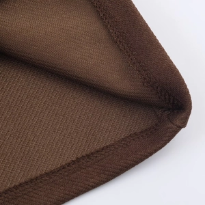 Close-up of dark brown knit fabric showing high-quality double-needle stitching on hems