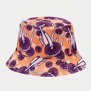 Close-up of mushroom pattern embroidery and reinforced stitching on tie-dye bucket hat