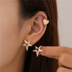 Gold star earrings with zircon and heart ear cuff set shown on a model for daily wear