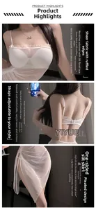 Detailed view of white mesh lingerie featuring ruffled edges and adjustable straps