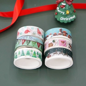 Detailed view of 6-roll Christmas washi tape set with reindeer and snowflake patterns
