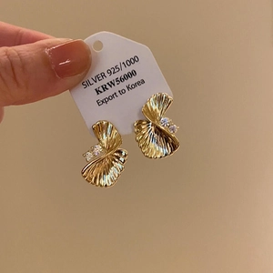 Golden leaf drop earrings in twisted fan shape with zircon inlay and 925 silver needles