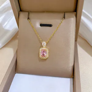 Elegant gold titanium steel necklace featuring a pink gemstone square pendant with diamonds