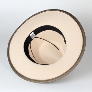 Detailed view of the interior and care label of a wide-brimmed felt jazz hat