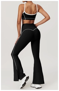 Detail of backless sports top and flared leggings with white contrast stitching