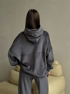 Dark grey velvet tracksuit featuring a loose hooded sweatshirt and matching trousers