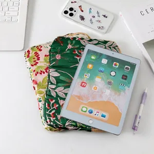 Embroidered floral quilted laptop sleeve for iPad and 15-inch notebooks in green and beige