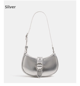 Detailed view of silver crescent shoulder bag with metallic finish and metal ring buckle