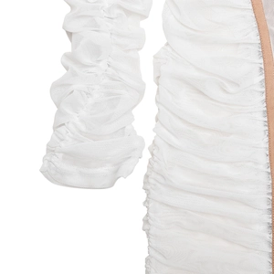 Detailed macro shot of white pleated mesh fabric with nude-toned decorative edge trim