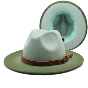 Detail of wool fedora featuring light green crown and army green brim with leather belt
