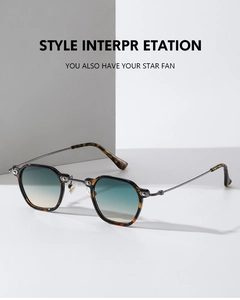 Detail of retro small frame sunglasses with tortoiseshell texture and gradient lenses