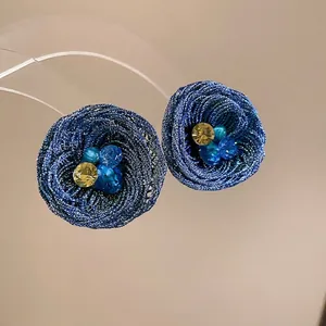 Handmade woven blue wire flower earrings with yellow and blue crystal accents for women