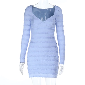 Detailed view of long sleeve mini dress with V-neck and horizontal pleated texture