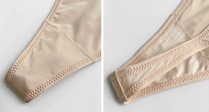 Detailed close-up of zigzag stitching and reinforced edges on beige ice silk thong