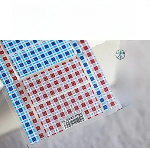 Detailed macro view of TS-387 5D Scottish plaid nail art stickers in blue and red tones