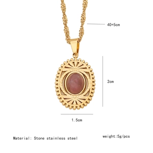 Detailed view of golden stainless steel necklace with pink oval stone pendant