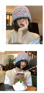 Close-up of colorful chunky knit bucket hat with soft pink and blue yarn texture