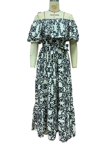 Detail of blue scroll print off-shoulder maxi dress with tiered ruffles and waist tie