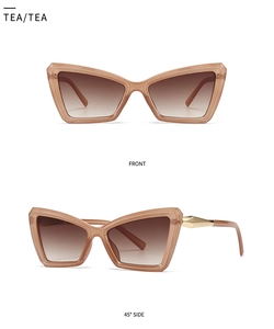 Tea cat eye sunglasses featuring gold metal temples and gradient lenses from two angles