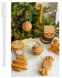 Gingerbread themed Christmas ornaments with icing patterns on a festive lace tablecloth
