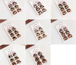 Detail of leopard print mini hair claw clips in various patterns on display cards