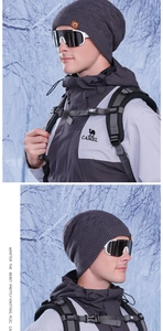Winter knit beanie with faux leather logo patch and matching snow goggles for outdoors