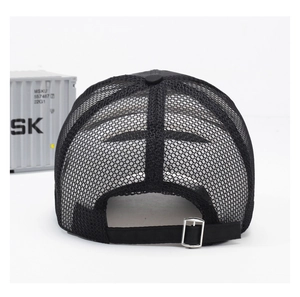 Detail view of the breathable mesh back and adjustable silver metal buckle on the black cap