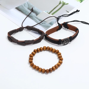 Detail of 3-piece set with brown leather weave, life tree charm and wooden beads