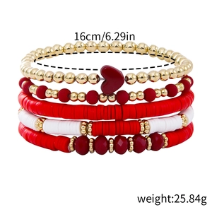 Detail view of five-piece bohemian bracelet set with polymer clay beads and heart charm