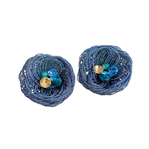 Blue wire-wrapped flower stud earrings with sparkling crystals on white background
