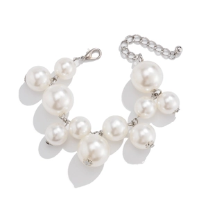 Detail showing high-lustre faux pearls and silver adjustable metal chain with lobster clasp