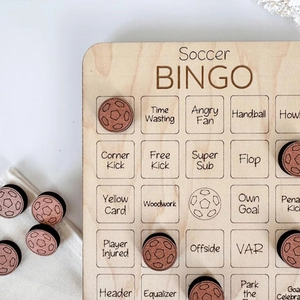 Macro detail of wooden Soccer Bingo game board with engraved football terminology pieces