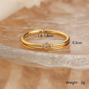 Detailed view of gold V-shaped ring with zircon and precise size measurement marks
