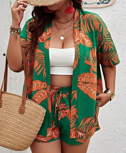 Detail showing green tropical leaf print fabric and texture of the summer vacation set