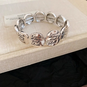 Religious stretch bracelet with vintage silver pendants featuring Christ scripture text