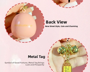Detailed view of pink lucky cat pendant with gold bell and love achievement tag