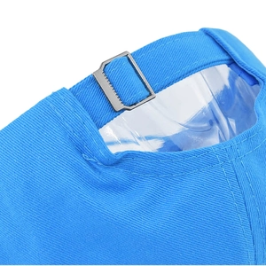 Detailed close-up of sky blue baseball cap with adjustable metal buckle and twill fabric