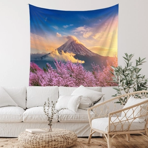 Detail view of Bohemian tapestry featuring Mount Fuji and cherry blossoms on a white wall