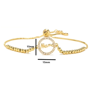 Detail of adjustable gold mama bracelet with 15mm micro-pave zircon circle pendant
