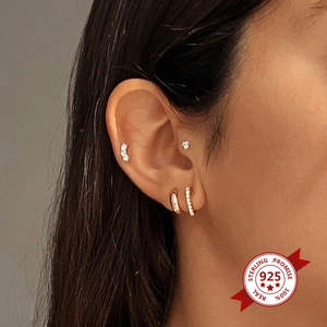 S925 sterling silver gold hoop earrings set with micro-pave rhinestones on model ear