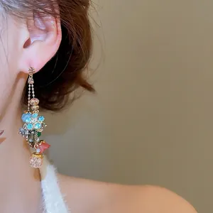 Exquisite crystal flower teardrop tassel earrings with vintage silver needle design