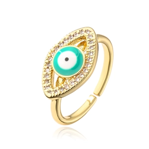 Detailed view of evil eye ring with turquoise enamel and zircon in gold plating