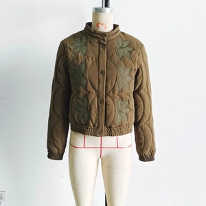 Olive green quilted jacket with vintage leaf embroidery and a stand collar design