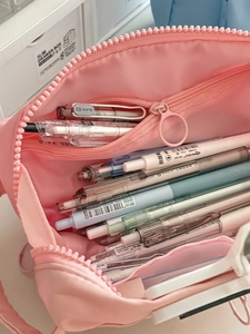 Detailed view of pink large capacity pencil case with oversized zipper and inner mesh pocket
