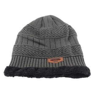 Detailed view of the dark grey knit beanie featuring a thick black fleece lining and leather tag